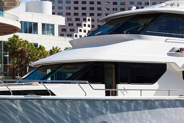 Closeup side view of luxury motorboat in marina, full frame horizontal composition