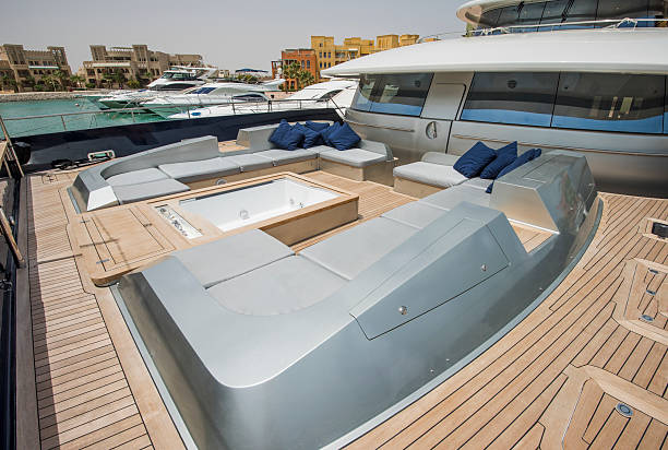 Front deck relaxation area of a large luxury motor yacht with seating area and hot tub